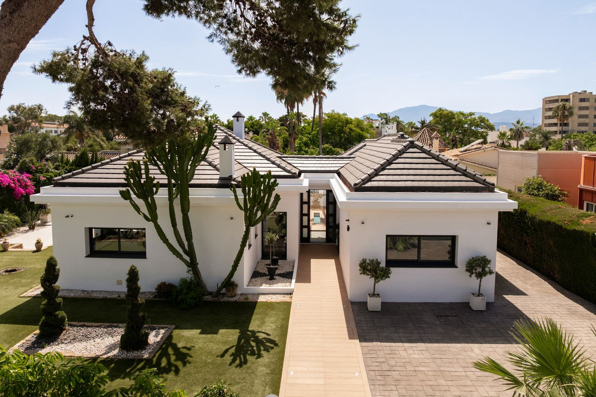 Aerial view straight over the entrance with a clear line of sight through to the pool